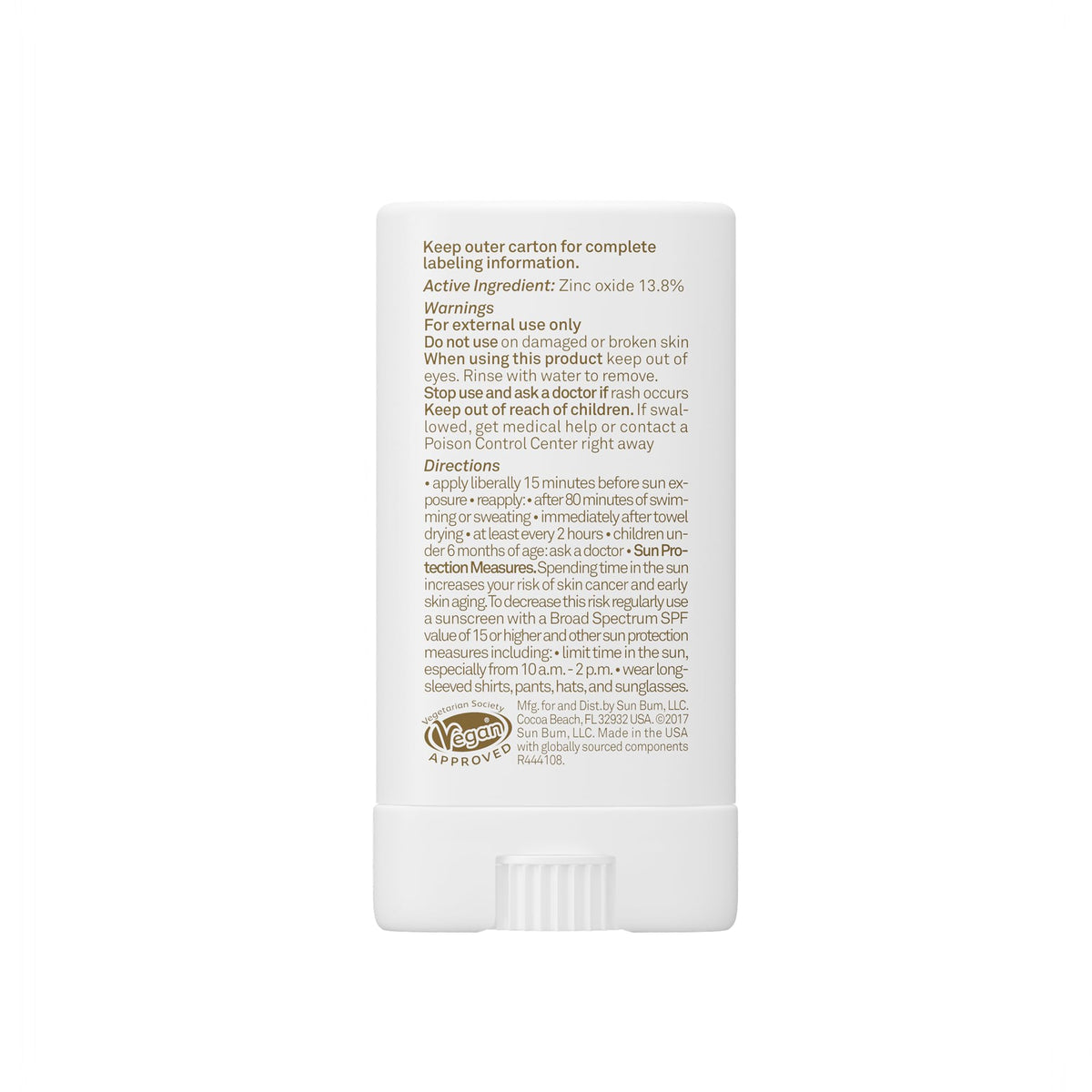 Sun Bum face stick on a beach towel showing reef-friendly outdoor use