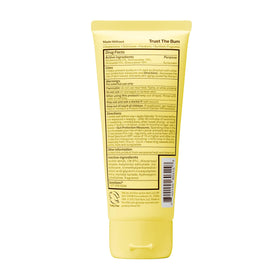Sun Bum bottle in beach scene conveying water-resistant outdoor protection