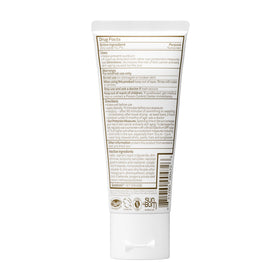 Sun Bum lotion in a beach setting illustrating reef-friendly protection