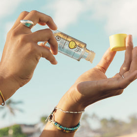 Sun Bum oil texture on hand demonstrating lightweight absorption and shine