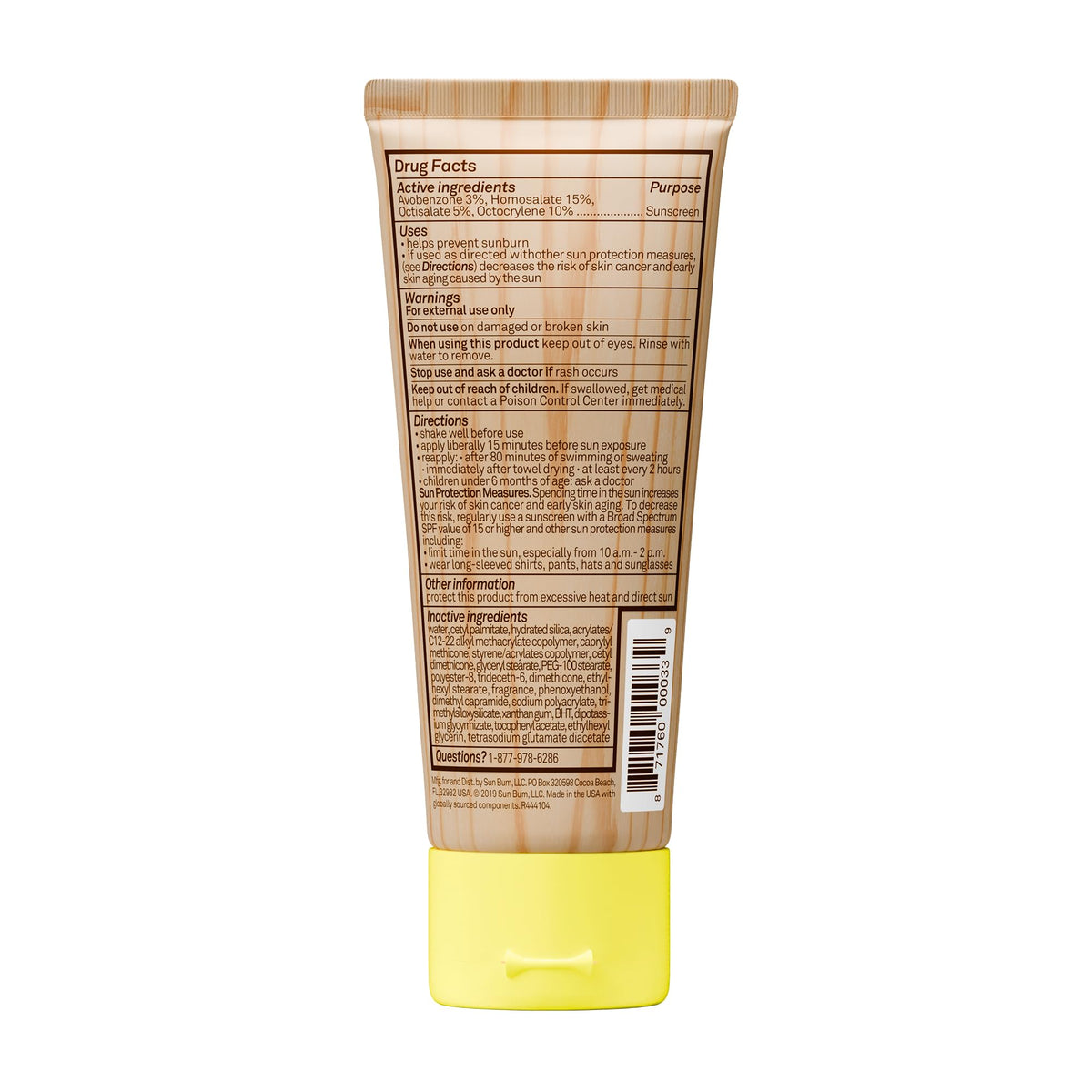 Sun Bum 3 oz tube beside passport and sunglasses for travel convenience