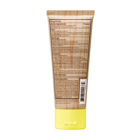 Sun Bum 3 oz tube beside passport and sunglasses for travel convenience