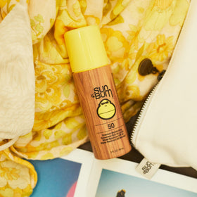 Close-up of Sun Bum lotion texture on skin demonstrating moisturizing vitamin E