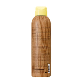 Sun Bum 6 oz bottle held in hand to show travel-friendly size and portability