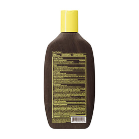 Sun Bum bottle next to sunglasses showing travel-friendly size benefit