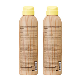 Sun Bum bottle in hand showing 6 oz scale for travel-ready convenience