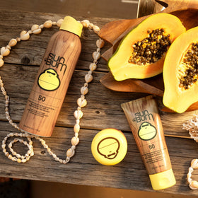 Sun Bum applying clear zinc SPF 50 to face, demonstrates easy absorption and protection