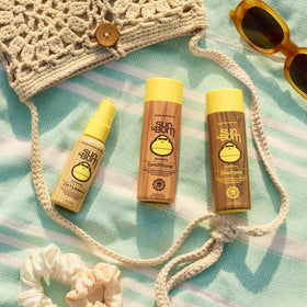 Sun Bum mist on hair strands showing lightweight hydration and reduced frizz