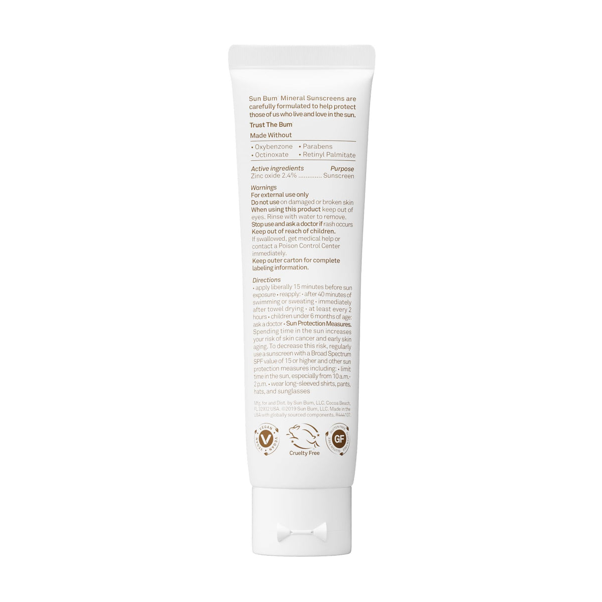Sun Bum travel-size tube beside passport for convenient portability
