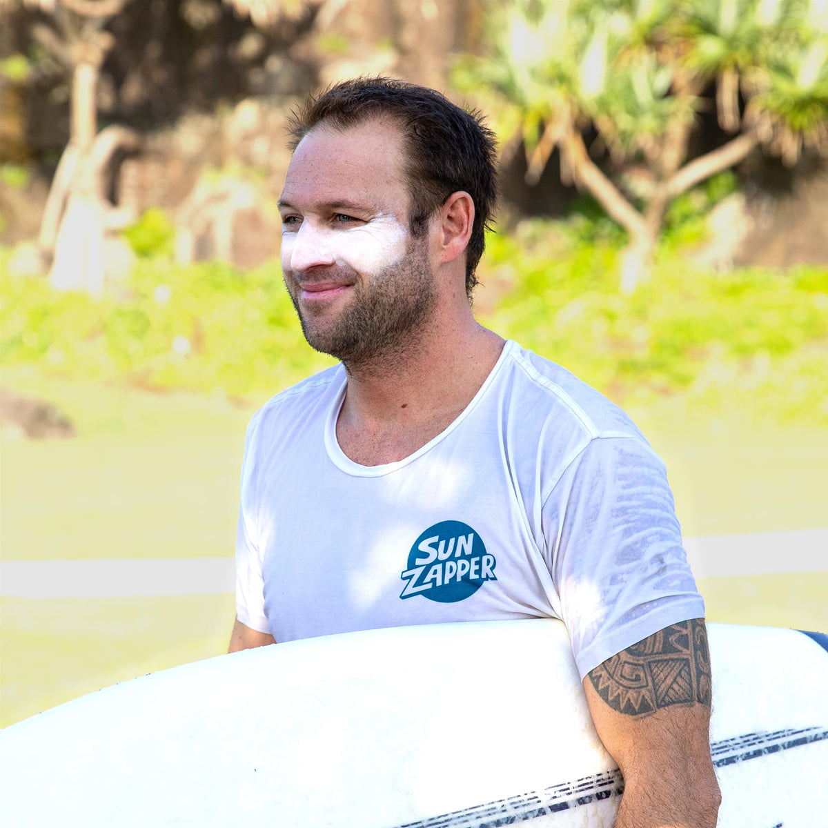 Sun Zapper stick on surfer face in waves highlighting water resistance