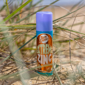 Sun Zapper in surf bag illustrating leakproof solid format and heat stability