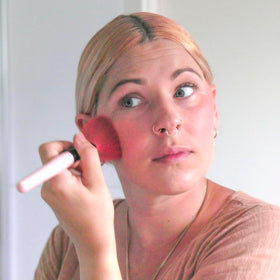 Sun Zapper pink blush swipe offering buildable color plus sun protection