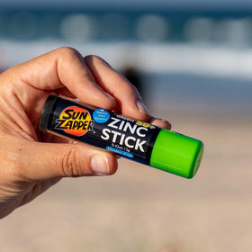 Sun Zapper size comparison next to credit card illustrating compact travel convenience