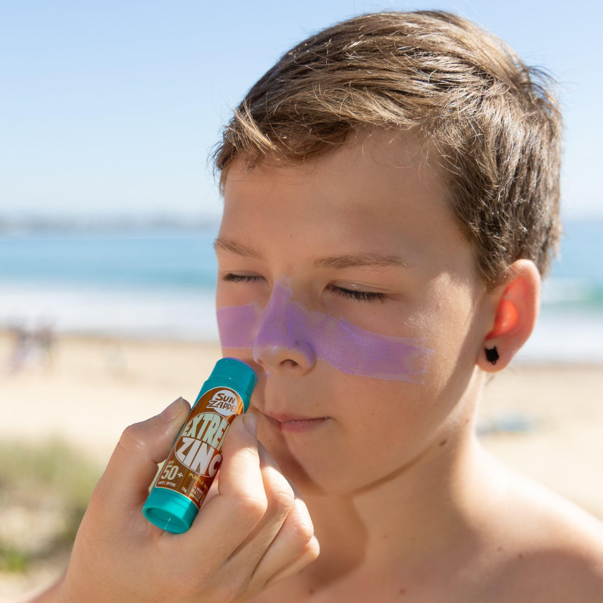Sun Zapper held in hand for scale highlighting compact 15g travel convenience