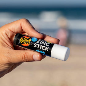Sun Zapper next to a hand for size scale and convenient travel benefit