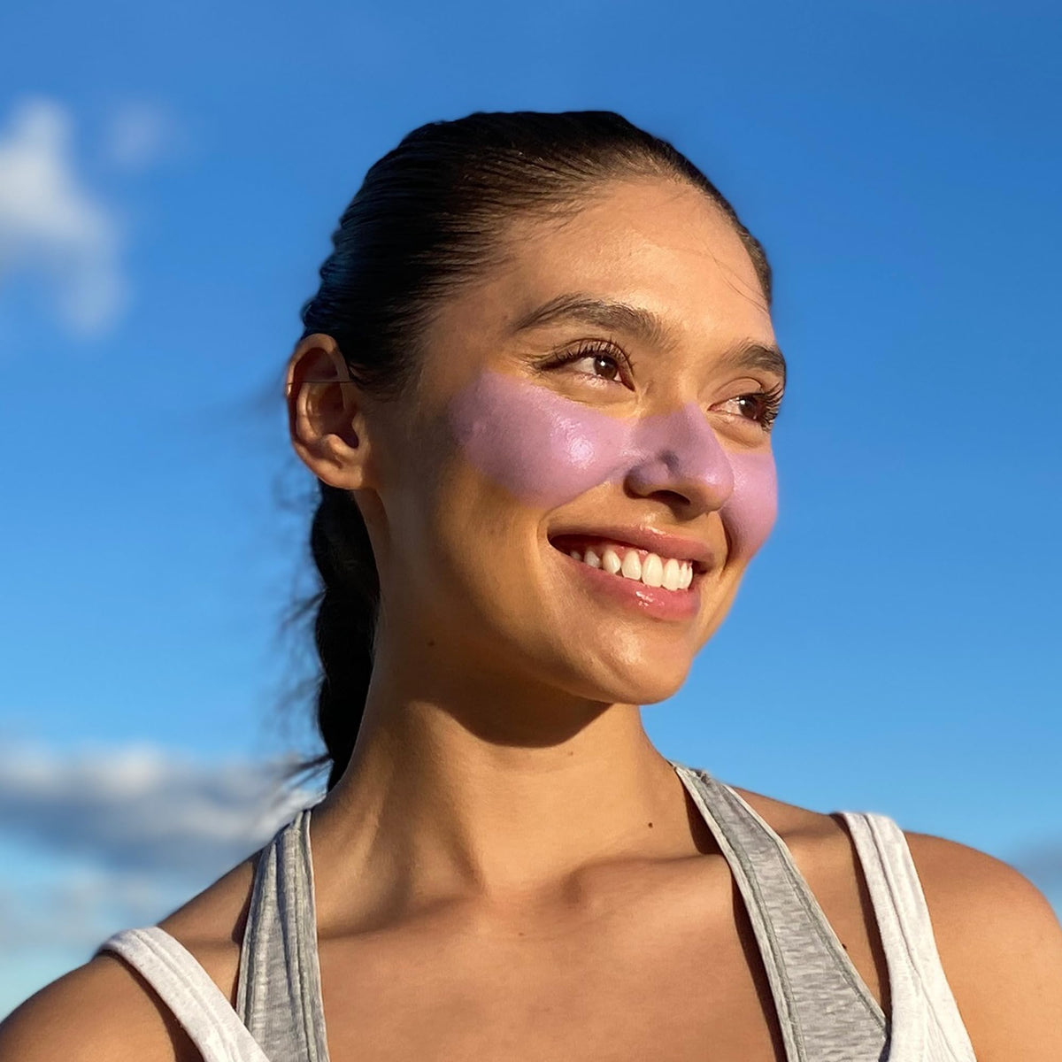 Sun Zapper stick on surfer nose in waves proving long-lasting water resistance