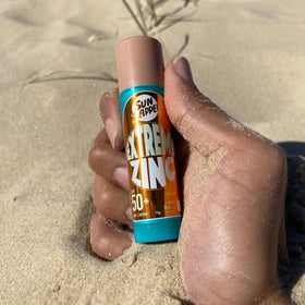 Sun Zapper stick illustrating prevention of excess UV exposure on face