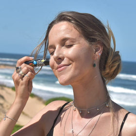 Sun Zapper stick in a pocket illustrating compact travel-size convenience