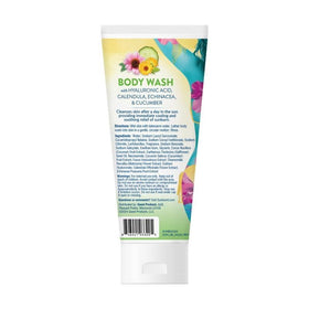 Sunburnt travel bottle on beach towel suggesting portability and post-sun relief benefit