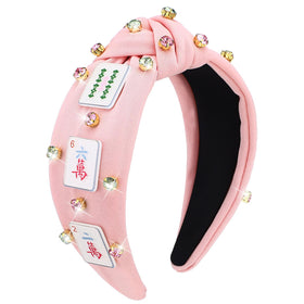 Suncalla front view headband showing mahjong charms and pink fabric, stylish accessory