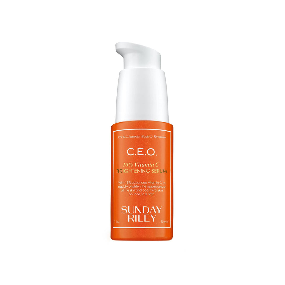 Sunday Riley bottle front view showing orange serum and clear labeling for brightening