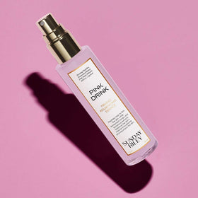 Sunday Riley Pink Drink mist spraying on face demonstrating easy application