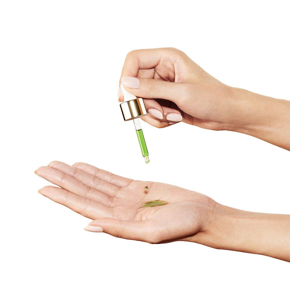 Sunday Riley U.F.O. oil drops on skin demonstrating non greasy finish and calming benefit