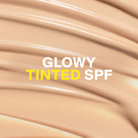 Supergoop! Glowscreen Sunrise tube close-up highlighting compact travel size benefit