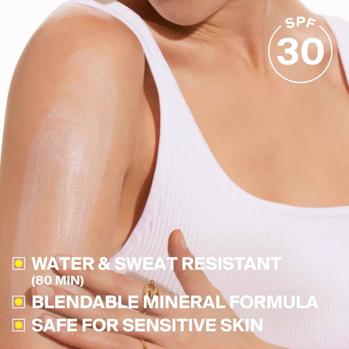 Close-up of Supergoop! mineral cream showing smooth non-greasy finish benefit