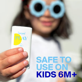Supergoop! PLAY Mineral Stick next to credit card illustrating pocket-sized convenience and portability