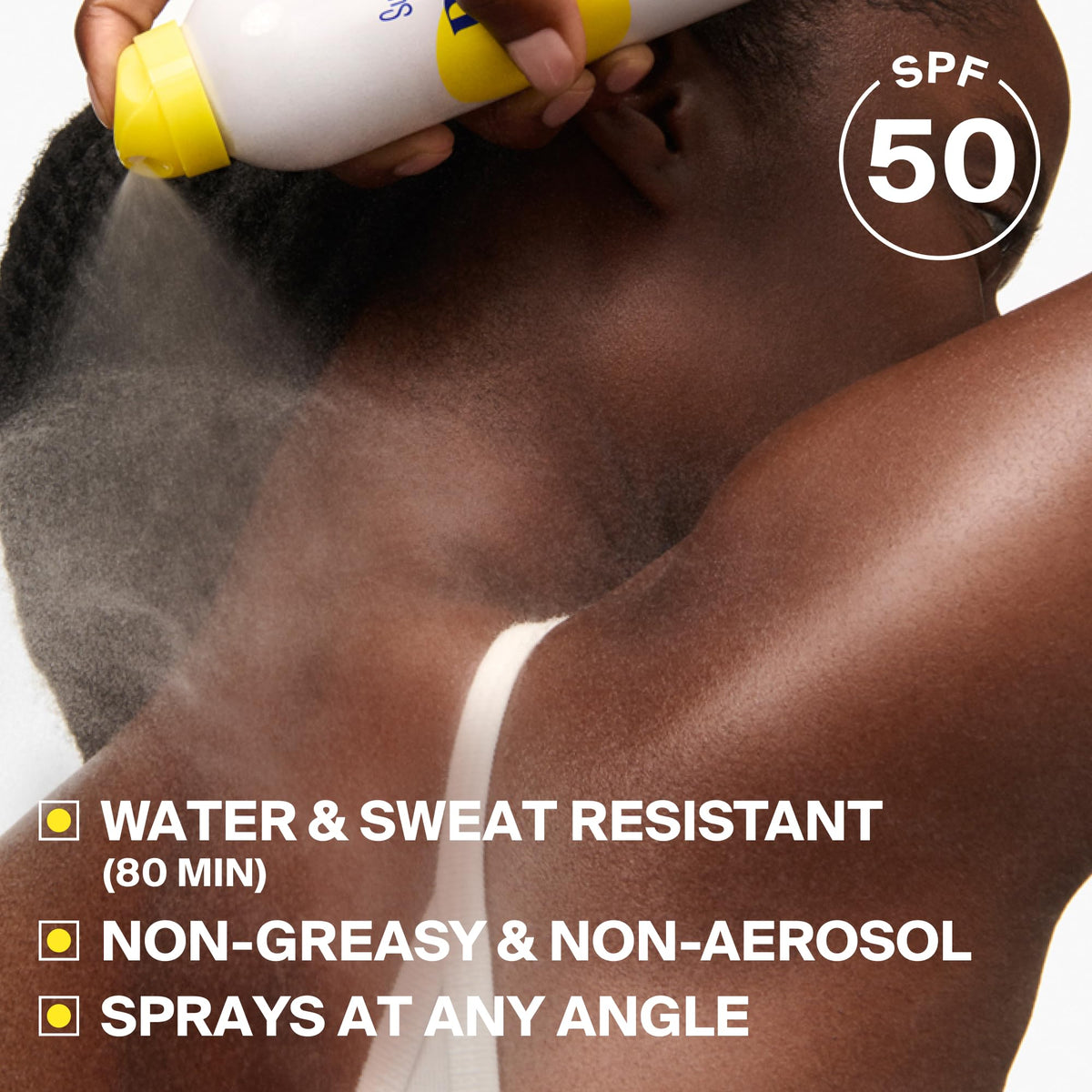 Supergoop! spray nozzle closeup demonstrating bag-on-valve angled spray benefit