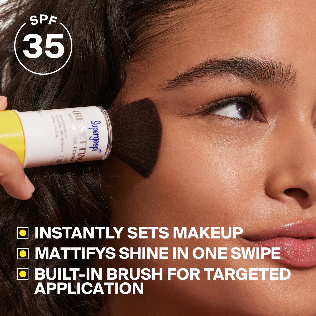 Supergoop! soft-bristled brush close-up showing precise powder pickup benefit