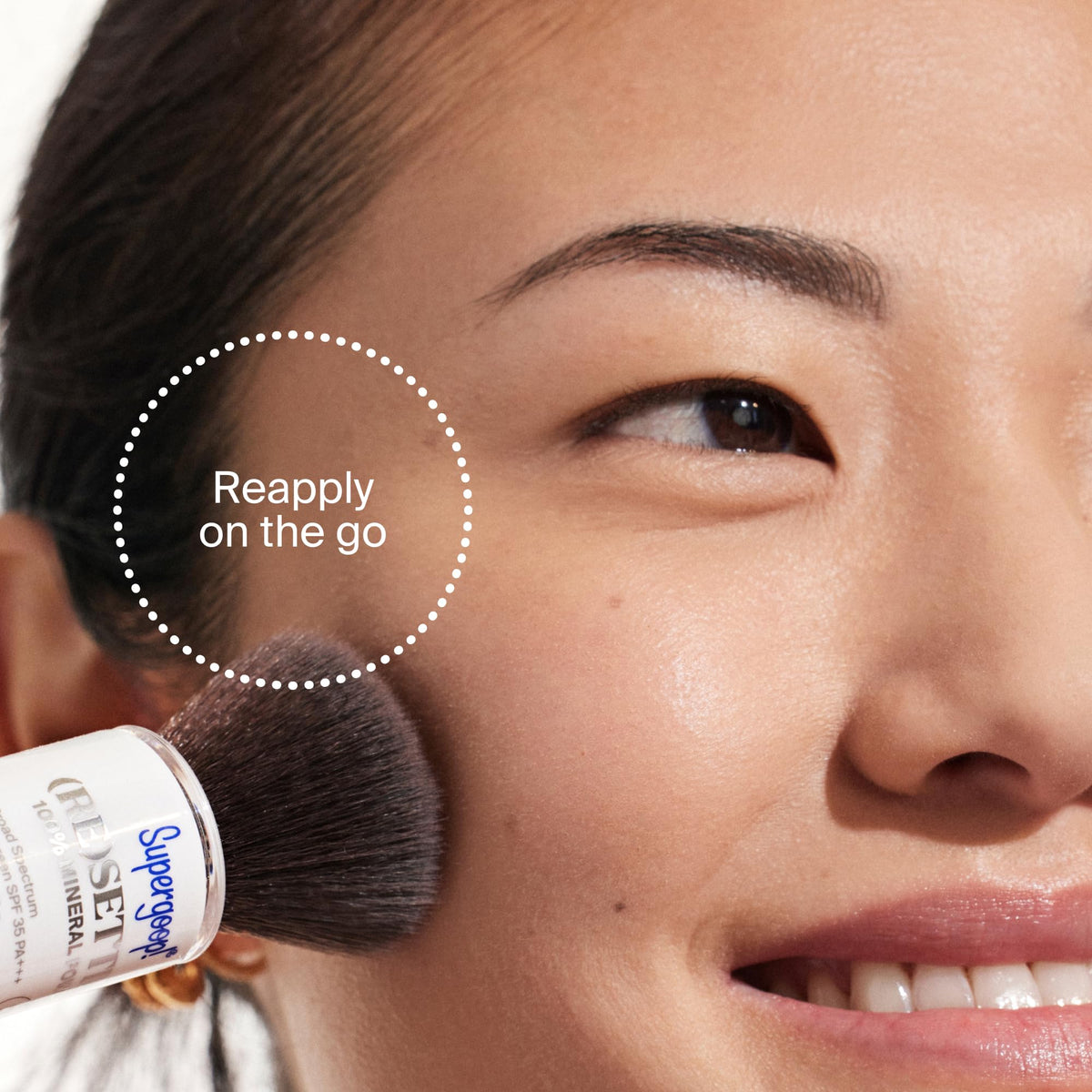 Supergoop! compact inside a handbag depicting on-the-go SPF reapplication