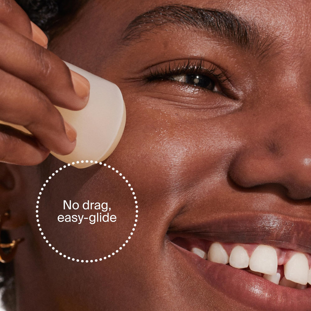 Supergoop! stick in hand to show compact 0.7 fl oz size and convenience