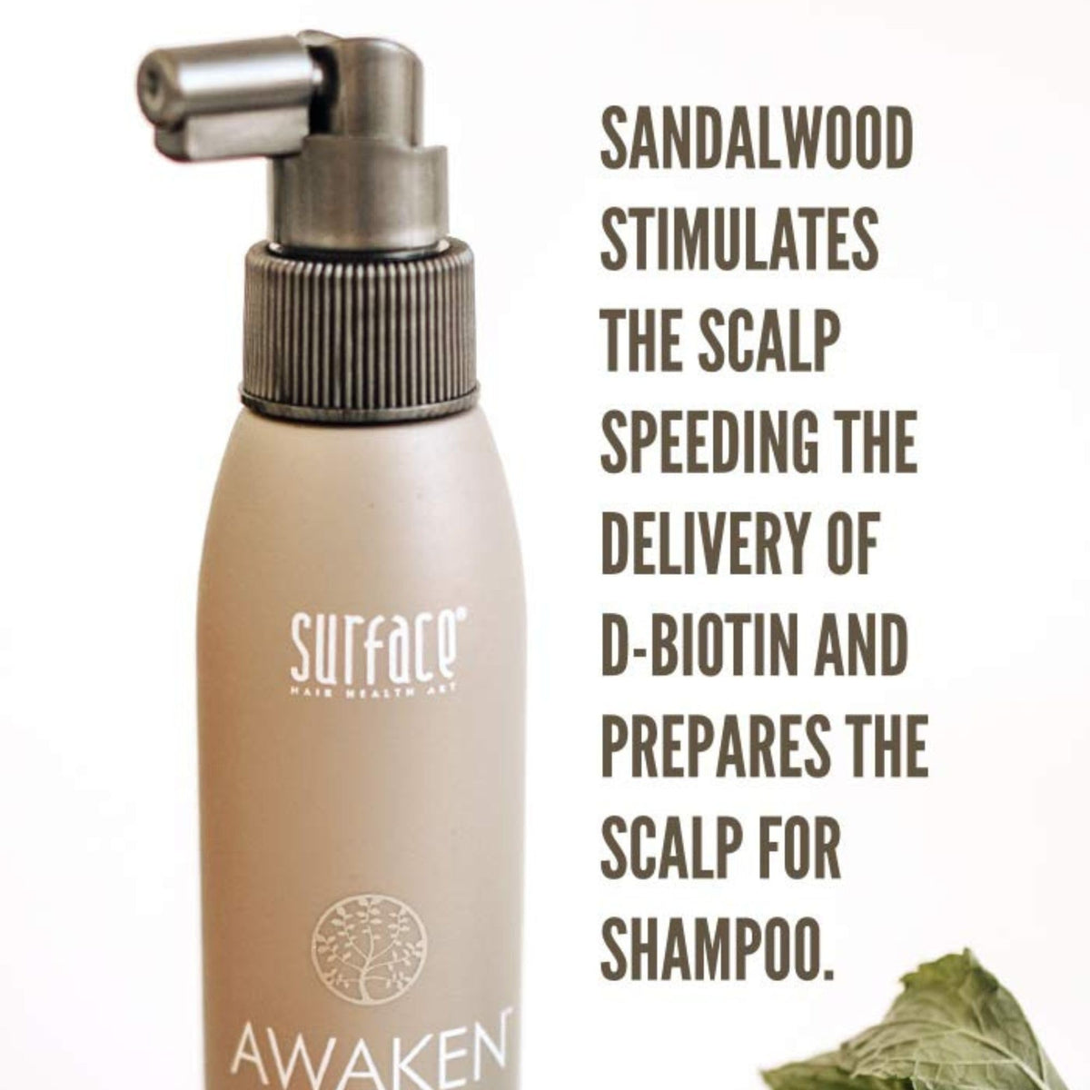 Surface bottle held in hand to show 4 fl oz scale and travel-friendly size