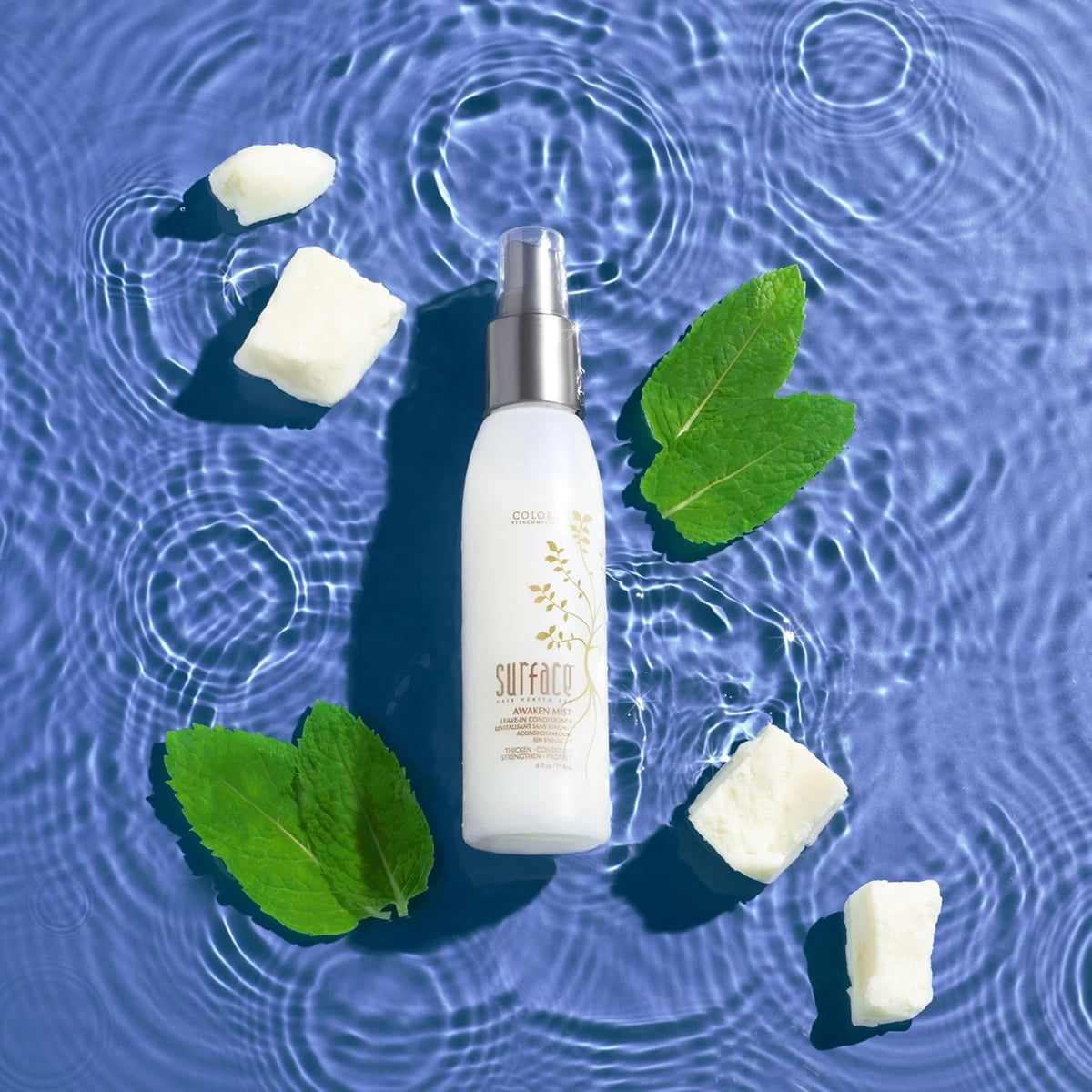 SURFACE model spraying mist on scalp to refresh and detangle hair