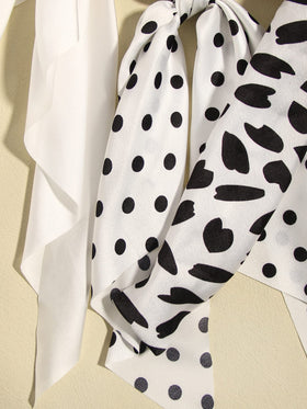 SUSULU scrunchies arranged on a dresser in a neutral lifestyle setting