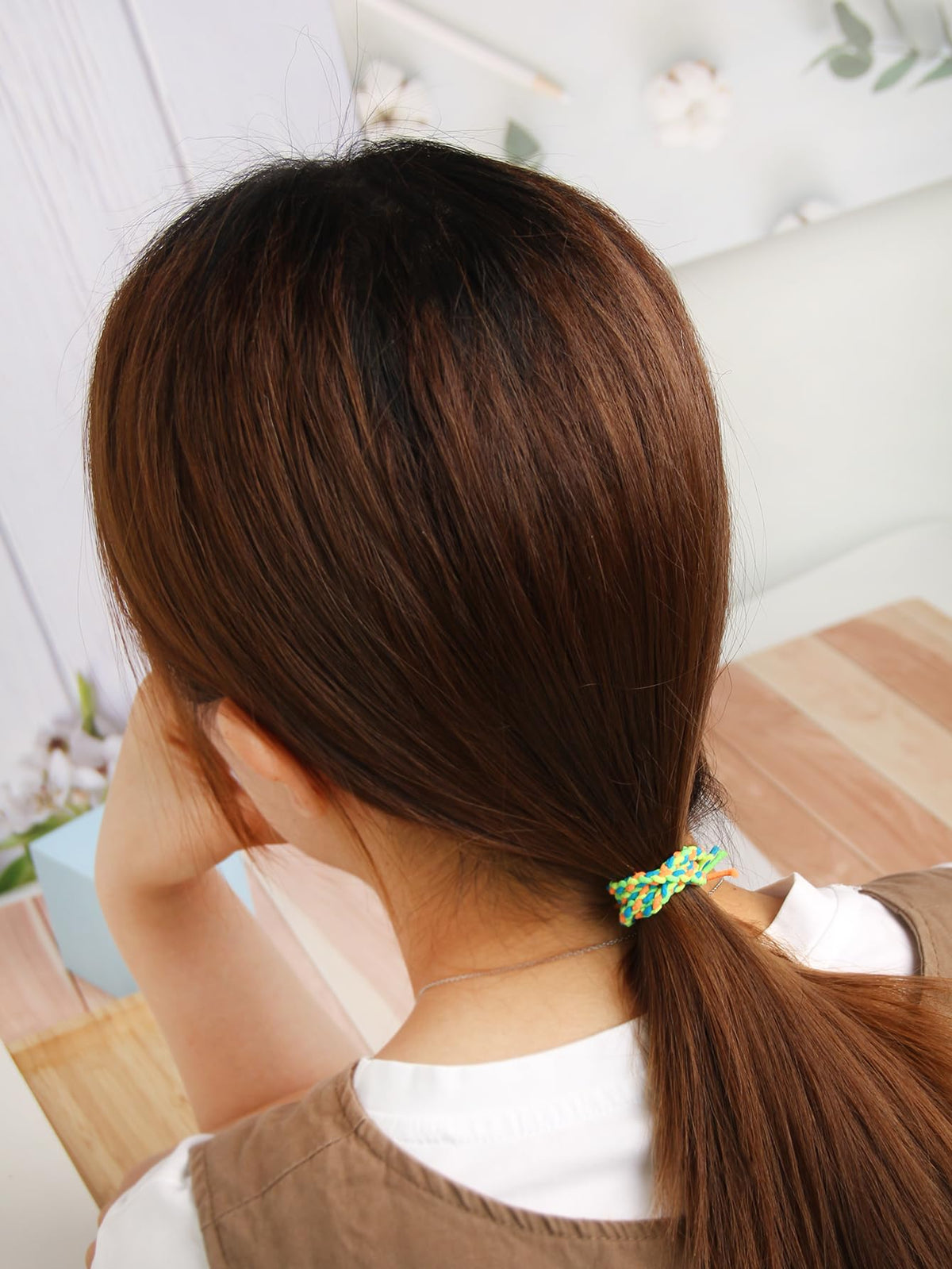 SUSULU hair tie worn as wrist bracelet offering portable styling and quick access
