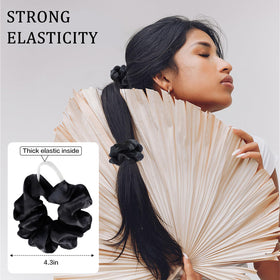SUTHIA size comparison with coin showing scrunchie loop scale for styling