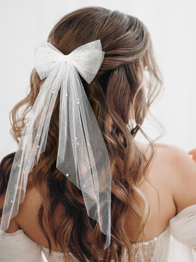 SWEETV close-up of satin bow and fixed pearls highlighting durability