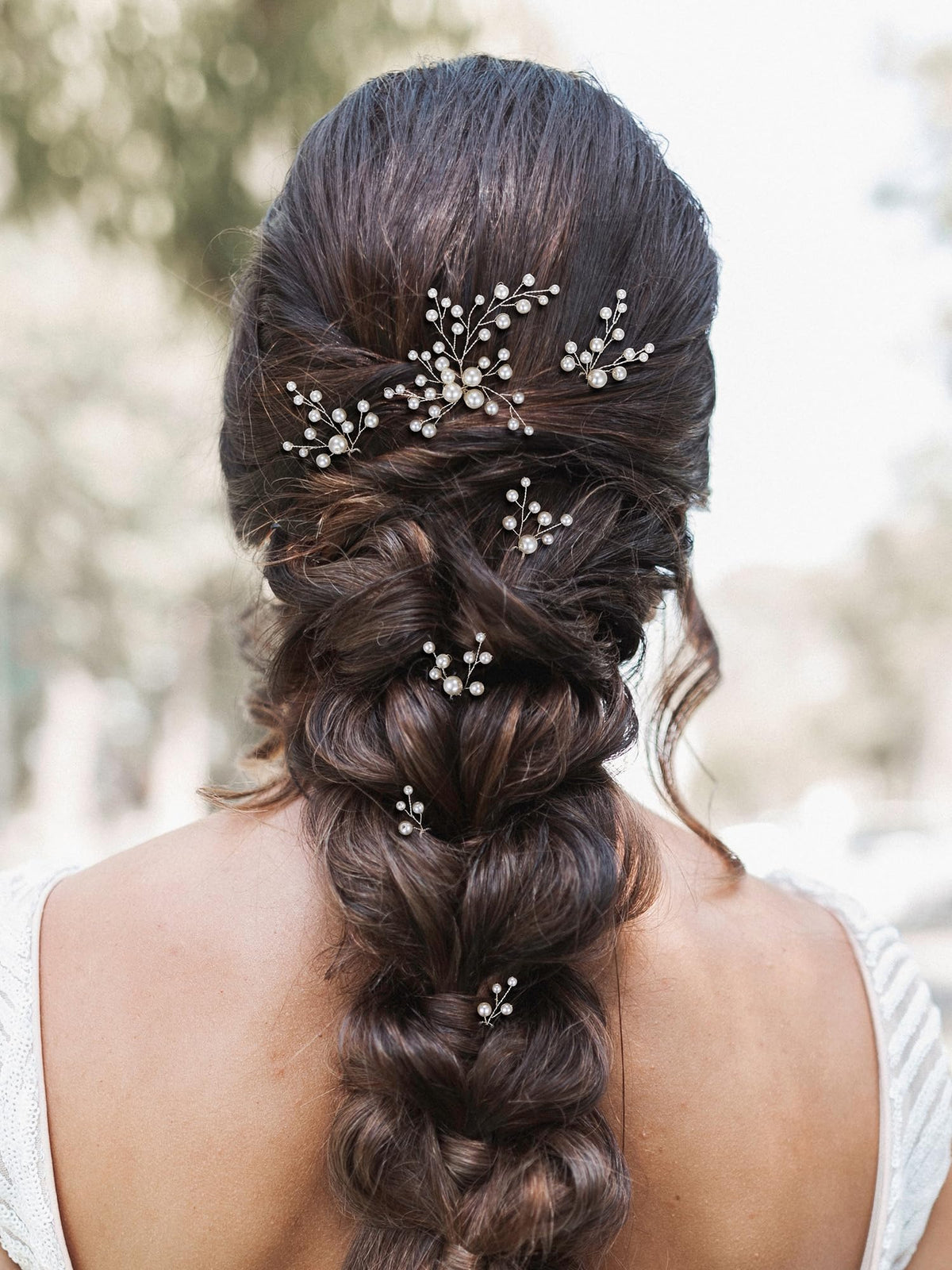 SWEETV close-up of pearl and rhinestone cluster highlighting sparkle and craftsmanship