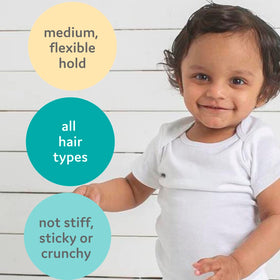 T is for Tame product in use misting child’s hair for quick detangling