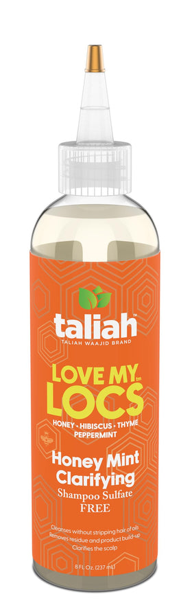 Taliah Waajid bottle held in hand for scale, compact 8 fl oz travel-friendly size