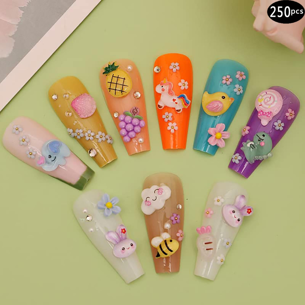 TAMHOO charms placed on an acrylic nail tip demonstrating secure, decorative finish