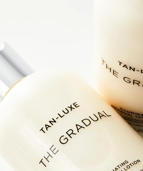 TAN-LUXE bottle on bathroom shelf staged in routine setting for daily use
