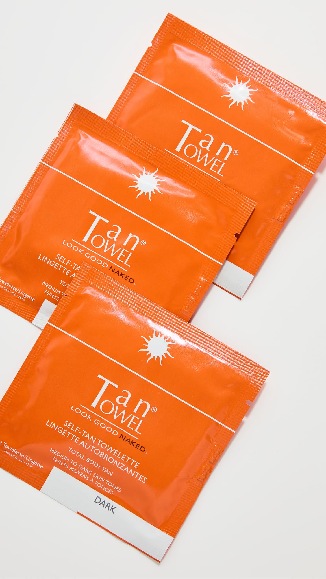 Tan Towel in-use application on leg demonstrating quick-dry benefit