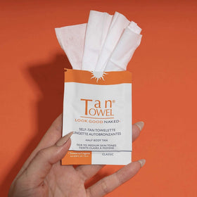 Tan Towel wipe texture close-up demonstrating clear formula and smooth application benefit
