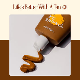 Tanning Club bottle on beach towel evoking summer tanning routine