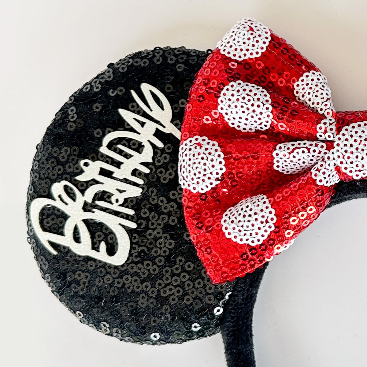 Tarocynn close-up of bow and sequins, highlighting handcrafted durable stitching