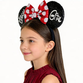 Tarocynn front view headband showing black sequin bow and ears, adds festive sparkle